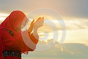 Veiled Islamic muslim woman wearing a burka standing