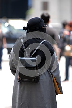 Veiled woman walking