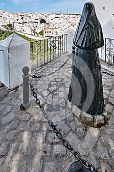 Statue of La Cobijada in the Andalusian white Andalusian village of Vejer de la Frontera photo