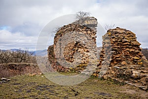 Velemin â€“ Oparno, Czech Republic, 27 February 2021: Stone gothic ruins of old medieval castle Oparno, ancient fortress in winter