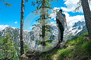 Velika Baba  - A hiking man on a hiking trail in the rocky sharp Kamnik Savinja Alps in Carinthia, Austria, Slovenia