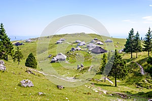 Velika planina plateau, Slovenia, Mountain village in Alps, wooden houses in traditional style, popular hiking