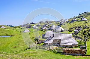 Velika planina plateau, Slovenia, Mountain village in Alps, wooden houses in traditional style, popular hiking