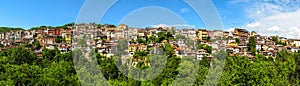 Veliko Tarnovo Bulgaria panorama - houses on the mountain - blue sky - hi resolution