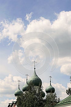 Veliky Novgorod, Russia, May 2018. Monastery domes on a background of blue sky with clouds.