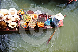 Vendor on floating market in Thailand photo