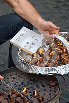 Vendor in Rome offering roasted chestnuts