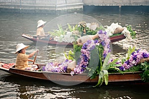 Vendor sell in floatig market,Bangkok,Thailand.