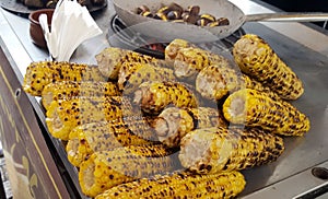 A vendor sell roasted corn and chestnuts