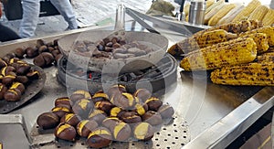 A vendor sell roasted corn and chestnuts