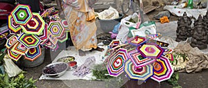 Vendor selling fresh flowers, vegetables, fruits, umbrella for devotees to bless Hindu god Ganesh at local market on the first day