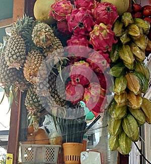 The vendor selling many variants fruits tropicals