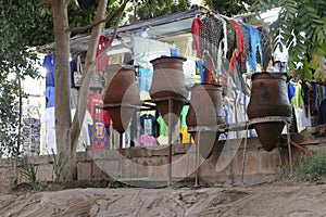 Vendors  entice tourists to buy clothing and other souvenirs