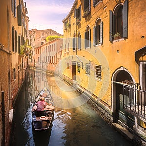 Venecia canal with boats and gondolas, Italy photo