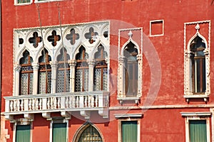 Venetian arched windows and balcony. Venice, Italy.