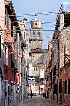 Venetian architecture: traditional neighborhood, laundry being dried on a clothes line. Venice, Italy