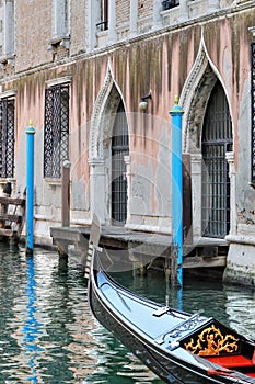 Venetian canal with boat passing