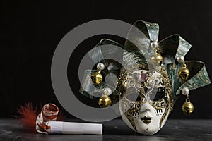 Venetian carnival mask and matasuegras