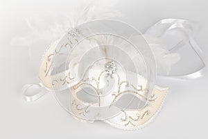 Venetian carnival mask in white and gold