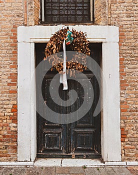 Venetian Elegance: The Charm of an Old Wooden Door