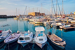 Venetian Fort in Heraklion and moored fishing boats, Crete Island, Greece