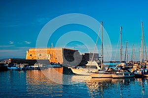 Venetian Fort in Heraklion and moored fishing boats, Crete Island, Greece