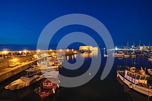 Venetian Fort in Heraklion and moored fishing boats, Crete Island, Greece