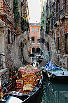 Venetian gondola staying at the canal.