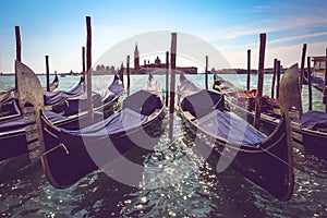 Venetian gondolas and San Giorgio Maggiore island in Venice, Italy