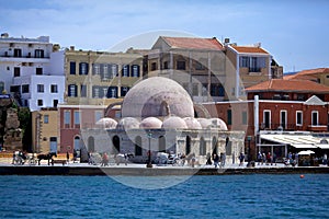 The Venetian Harbor with a view of the kyuchuk-Hasan mosque janissary mosque, the embankment with people walking and carriages w