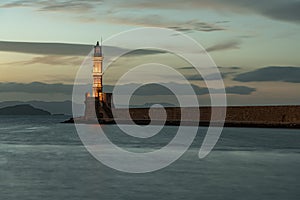 Venetian harbour and lighthouse in old harbour of Chania at sunset, Crete, Greece. Old venetian lighthouse in Chania, Greece. Ligh