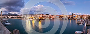 Venetian Harbour panorama with boats in front of restaurants