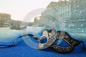 venetian mask in front of blurry Venice background