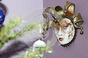 Venetian mask hanging on the wall