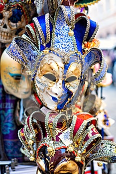 Venetian mask in store on street.