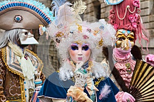 Venetian masked model from the Venice Carnival 2015 with near Plaza San Marco, Venezia, Italy