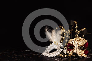 Venetian masks for carnival on a black background