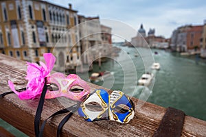 Venetian masks in the cityscape of Venice, Italy