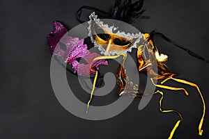 Venetian masks on dark background ready for carnival party