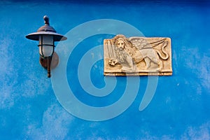 Venetian plate on blue photo