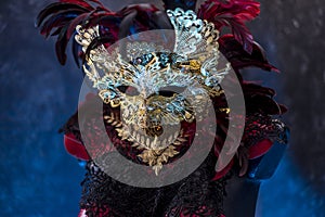 Venetian red, mask and red corset with pieces of gold and black