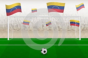 Venezuela football team fans with flags of Venezuela cheering on stadium, penalty kick concept in a soccer match