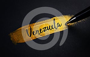 Venezuela Handwriting Text on Golden Paint Brush Stroke