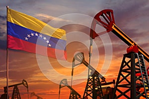 Venezuela oil industry concept. Industrial illustration - Venezuela flag and oil wells with the red and blue sunset or sunrise sky photo