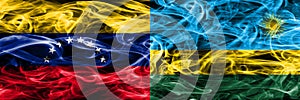 Venezuela vs Rwanda colorful concept smoke flags placed side by side.