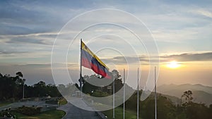 Venezuela Waving Flag Against Cloudy Sky