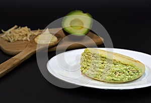 Venezuelan arepa queen pepiada with avocado and chicken typical food of venezuela photo