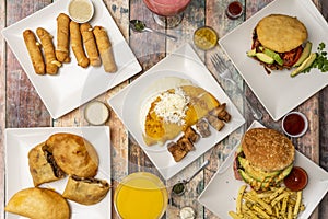 Venezuelan food plates with cachapa with queso de mano and pork rinds,