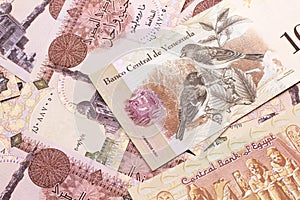 A Venezuelan Bolivares bank note with Egyptian one pound bank notes photo