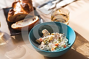 Venezuelan salad on display on table with traditional pan de jamon or ham bread, with cutlery and ready. traditional dishes of